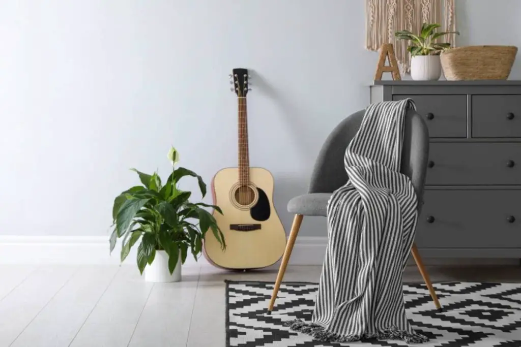 chair with guitar in center room