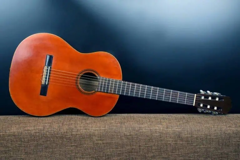 Best flamenco guitars: close-up of a nylon-string guitar on a dark background