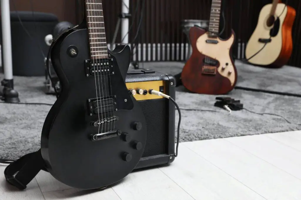 electric guitar with amplifier at recording studio