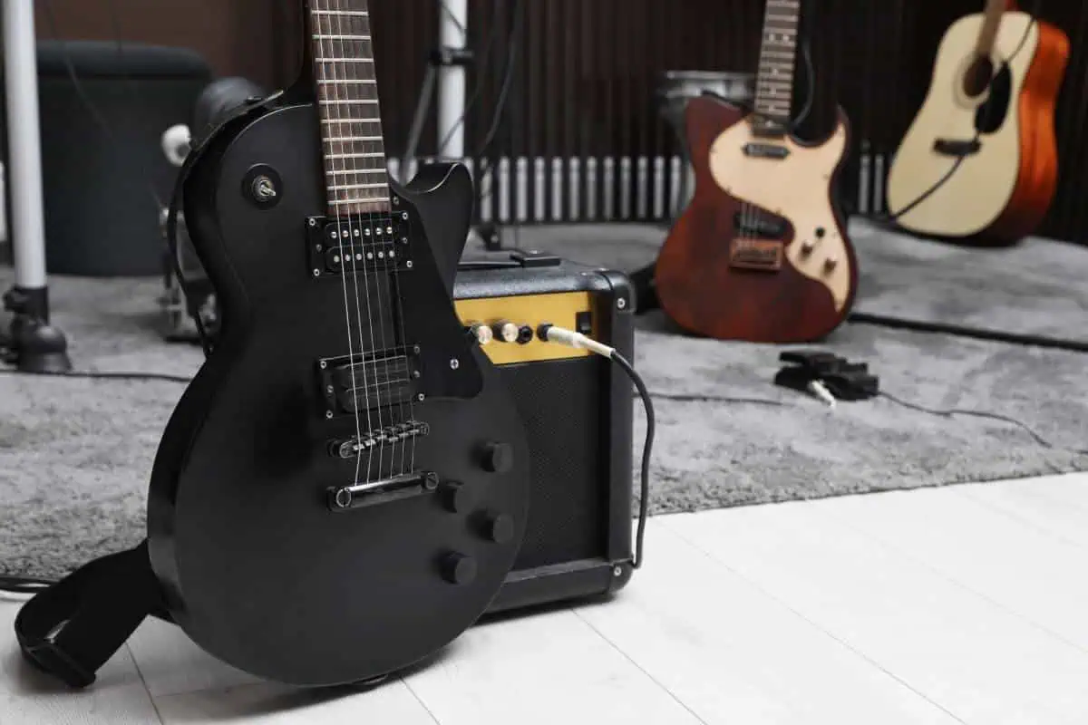 Acoustic treatment home studio setup around an amp and recording gear