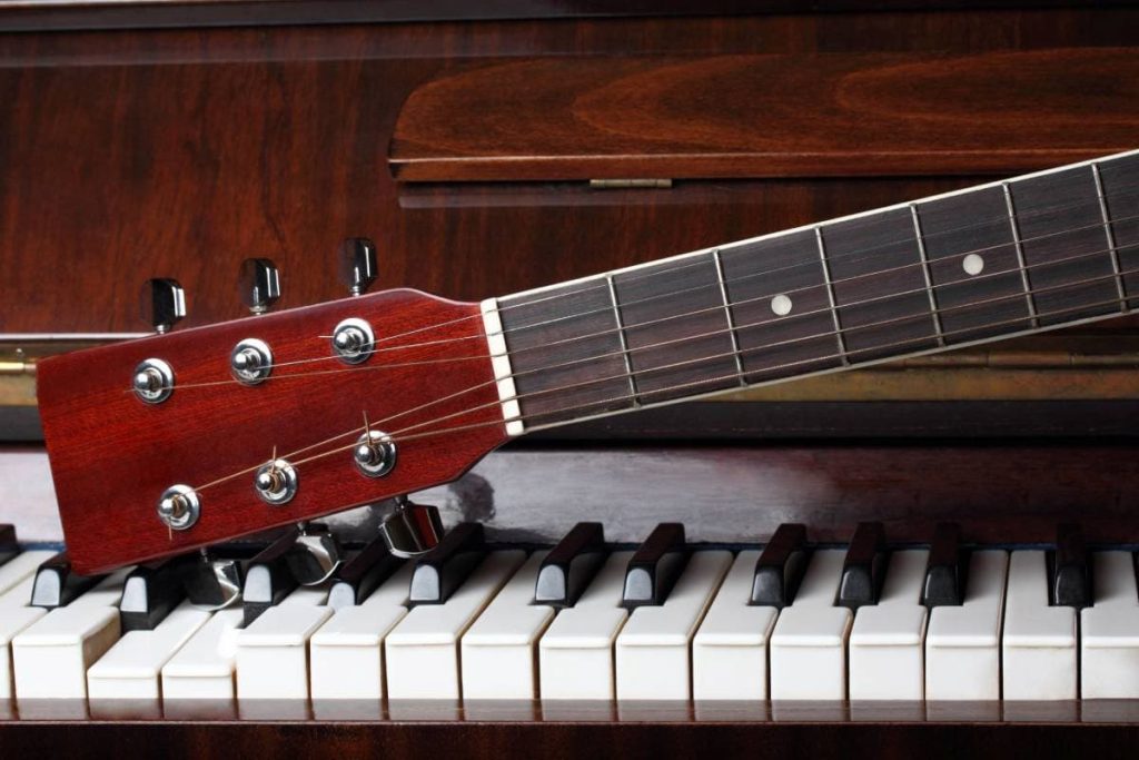 guitar neck on old piano keys