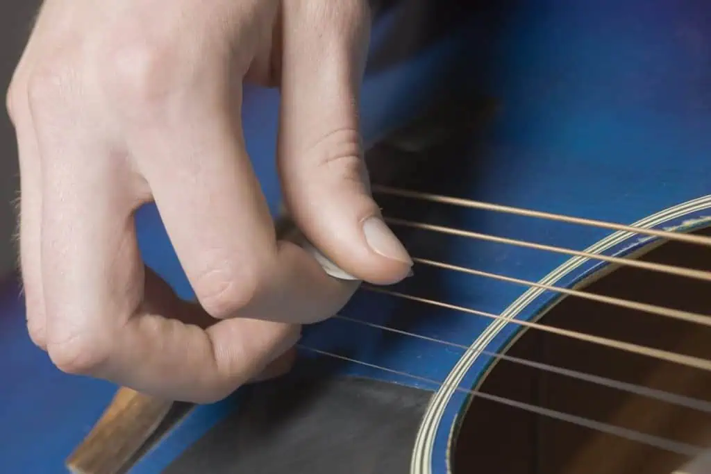 Should Beginner Guitar Players Use a Pick? 7 Facts 4 picks help you learn proper strumming techniques