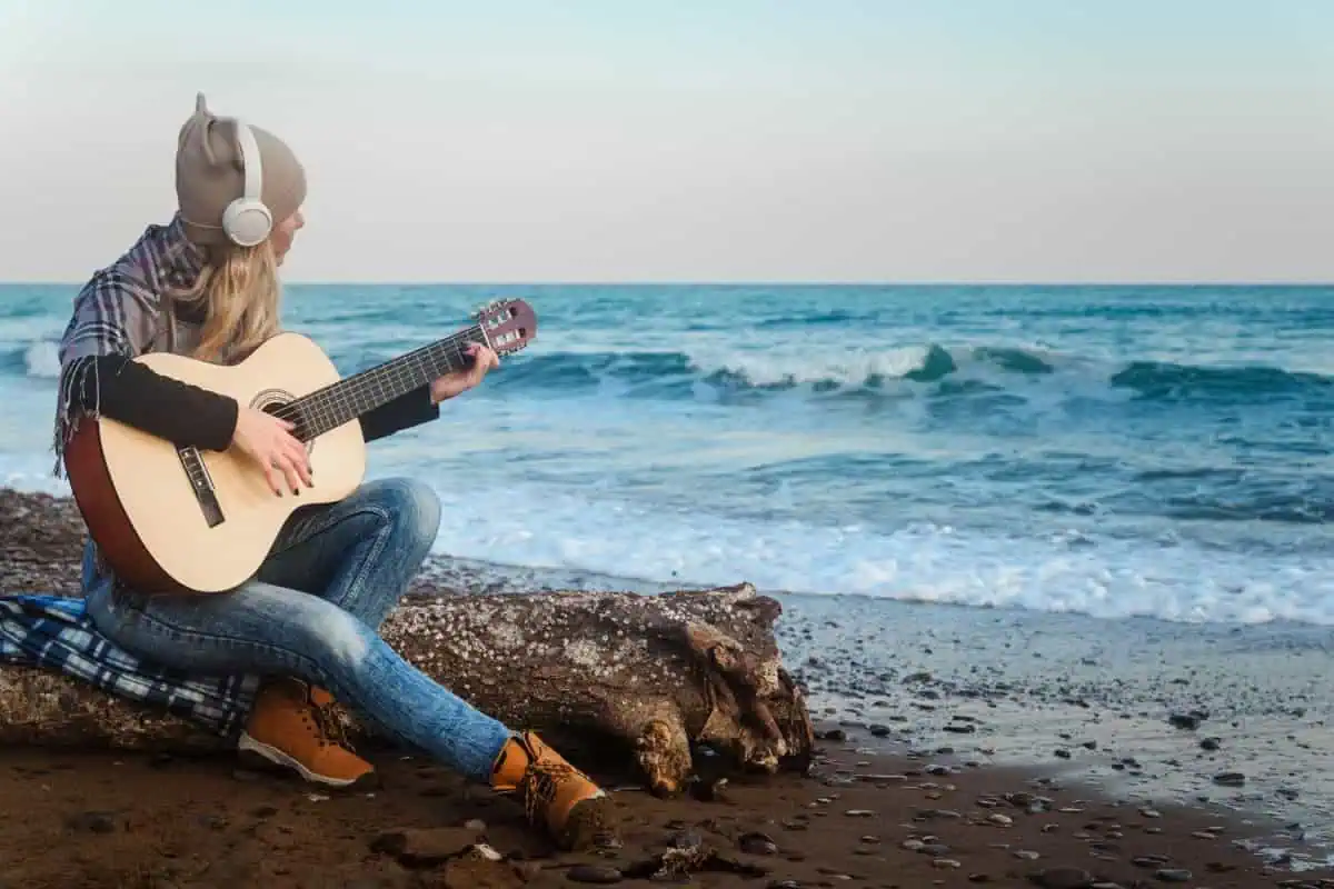 6 Best Headphone Amps for Silent Guitar Practice 2026: Tested Picks From $40 2 Headphone amp guitar setup: playing electric guitar with headphones for silent practice