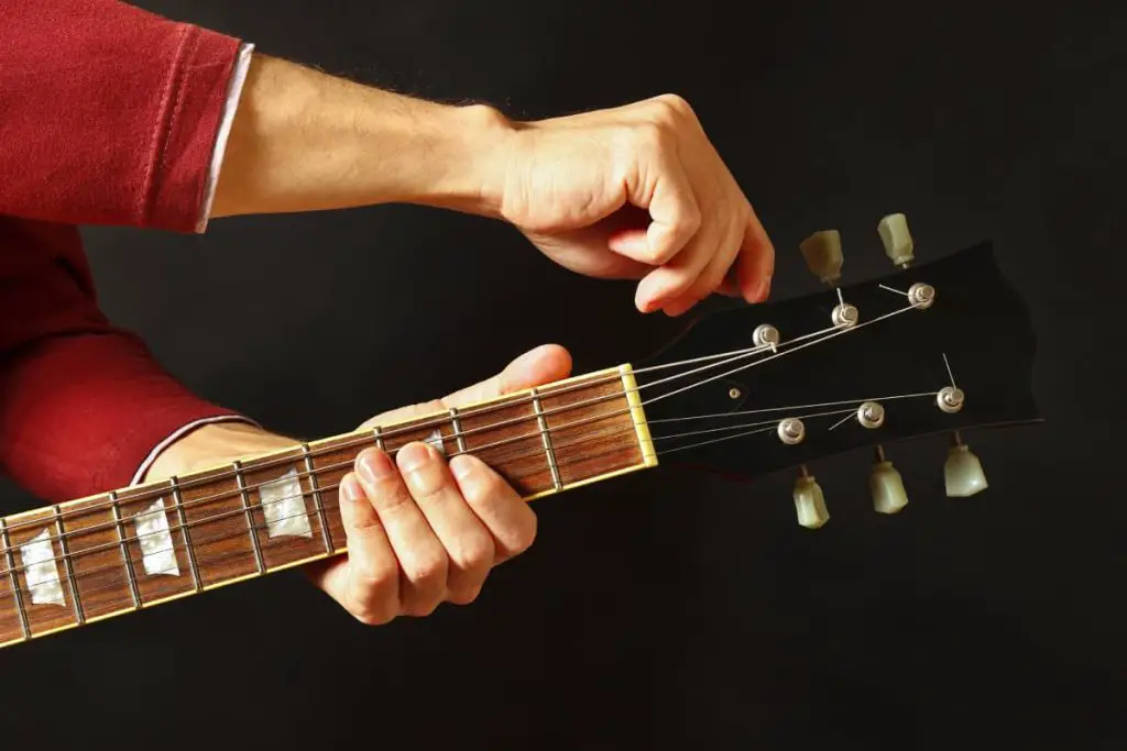 tuning the guitar