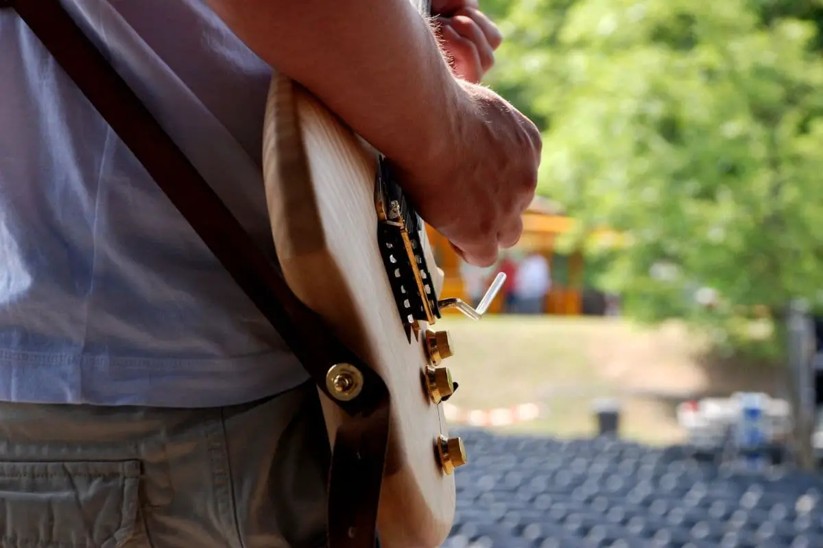 How To Keep a Guitar Strap From Falling Off (8 Ways)