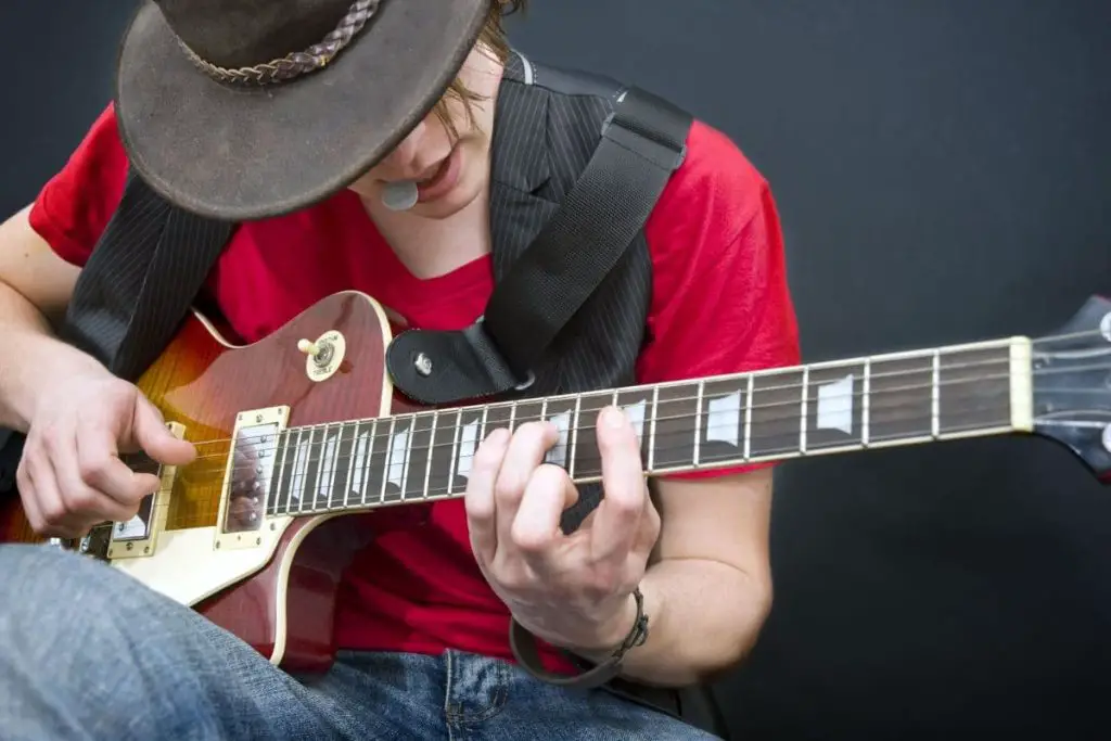 use strap locks to keep a guitar strap from falling off