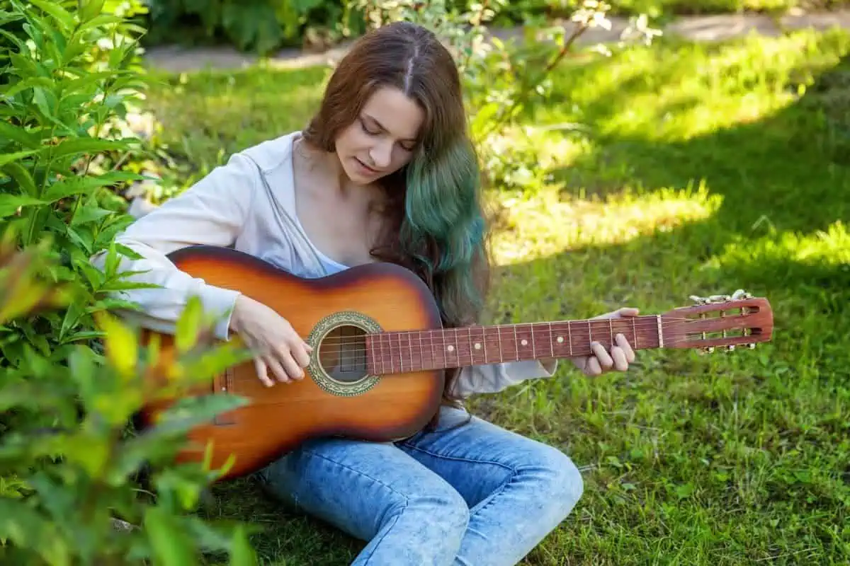 Guitarist playing diatonic chords in a key on guitar