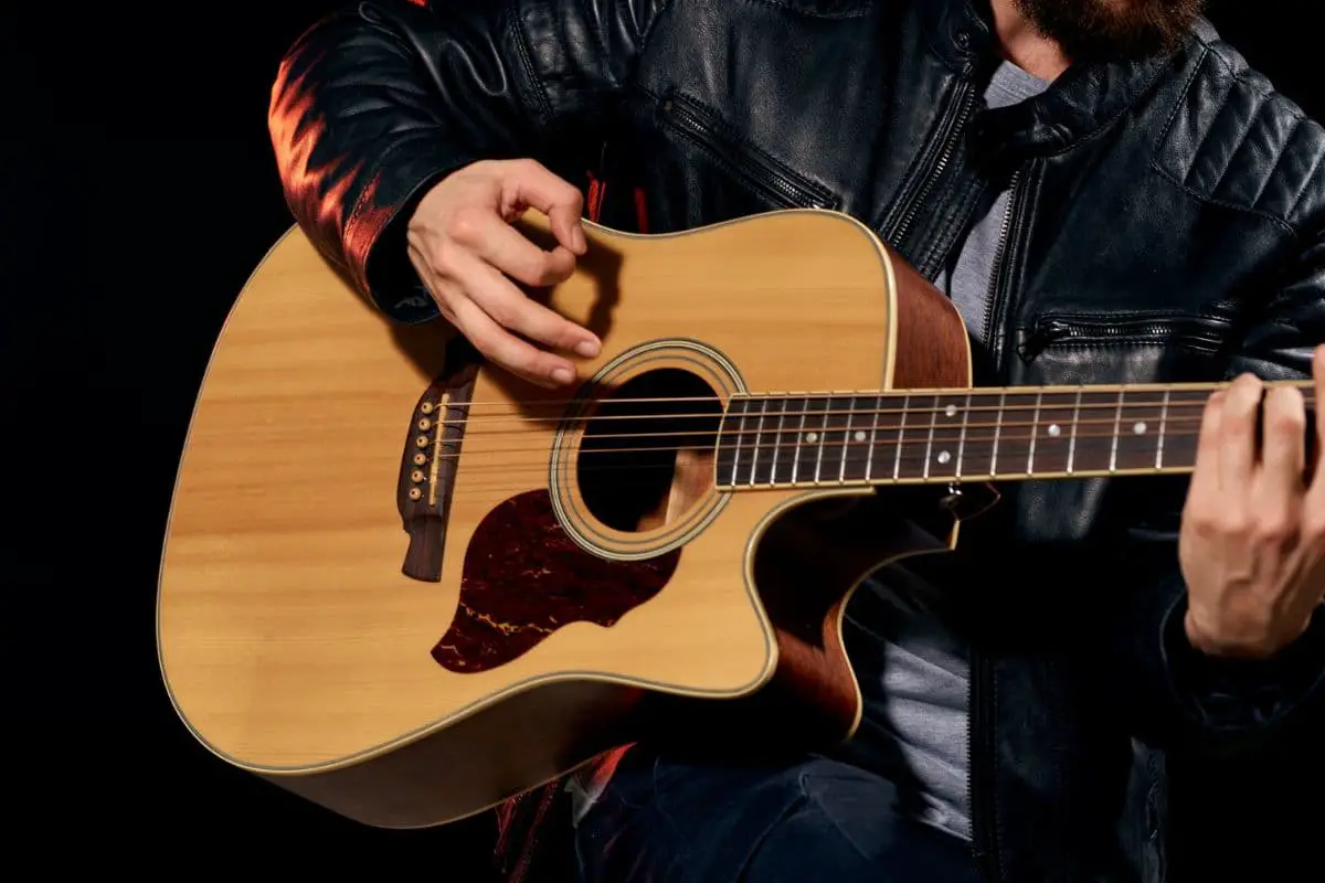 The Complete Guide to Holding a Guitar While Standing