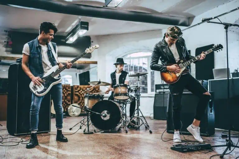 Worship band rehearsing together on guitars before Sunday service