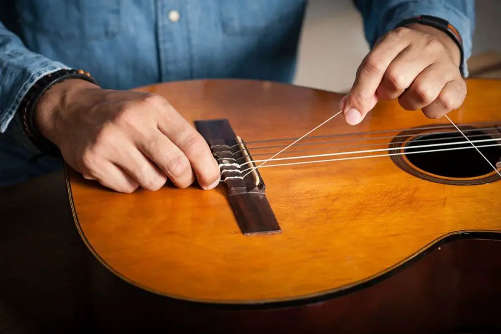 stretch your guitar strings