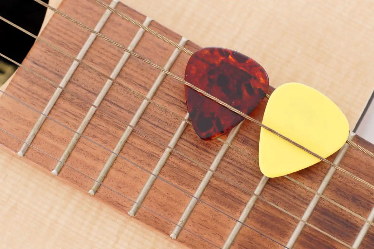 9 Ways to Make an Acoustic Guitar Quieter