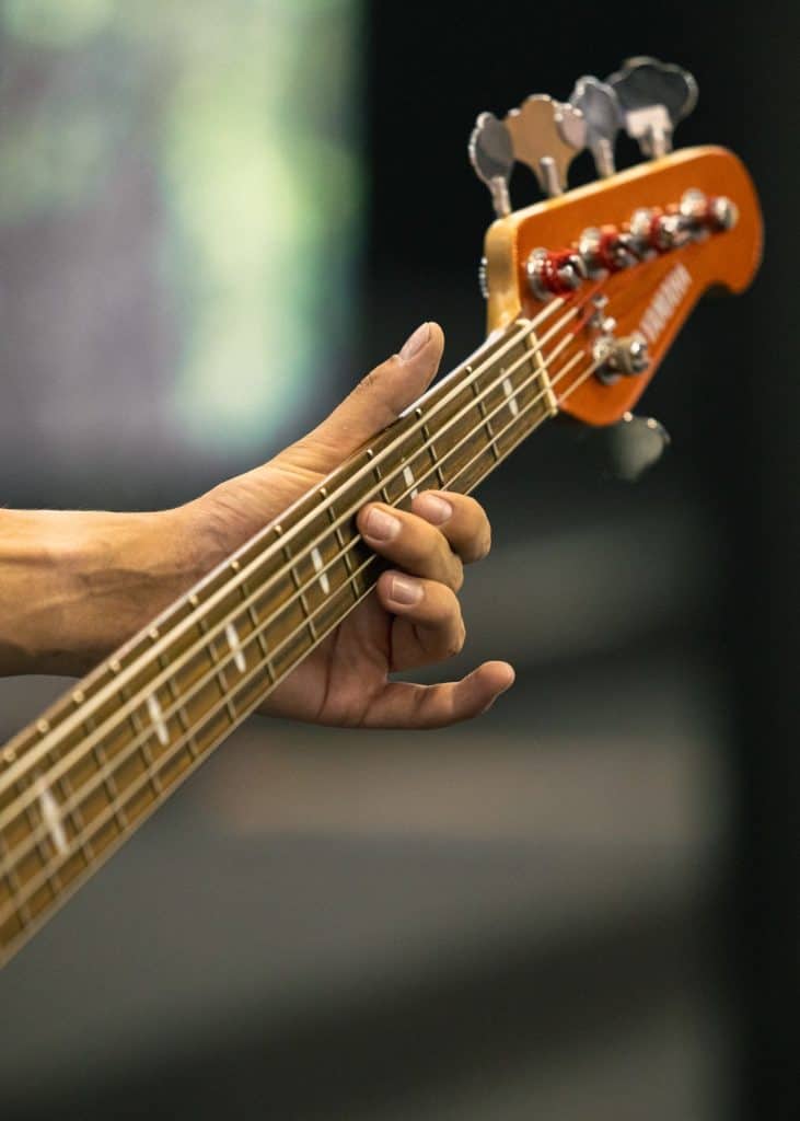 How to Set Up a Bass Guitar: 8 Easy Steps for Action & Intonation 2026 1 how to set up a bass guitar: close-up of fingerstyle bass playing