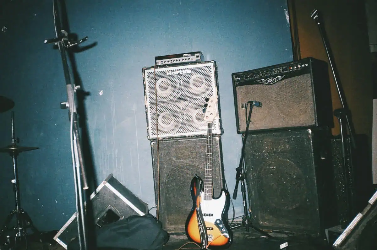 Acoustic treatment home studio: a room with guitars and recording gear that needs treating