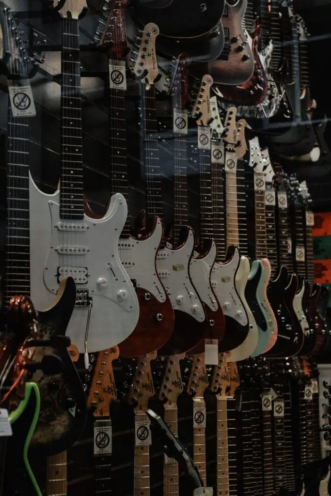 How to Choose an Electric Guitar: A Complete Guide 2026 1 Best headless guitars compared on a music store wall