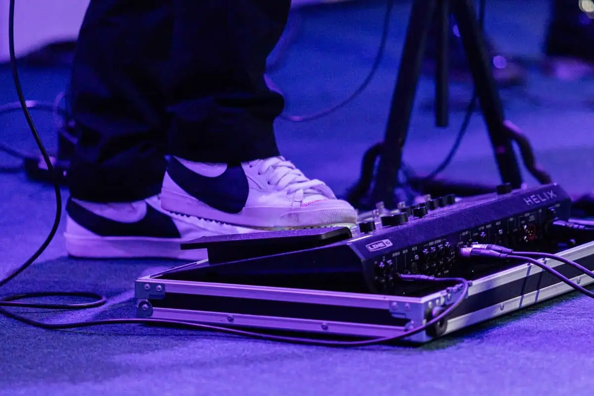 Guitarist rocking one of the best wah pedals on a live pedalboard