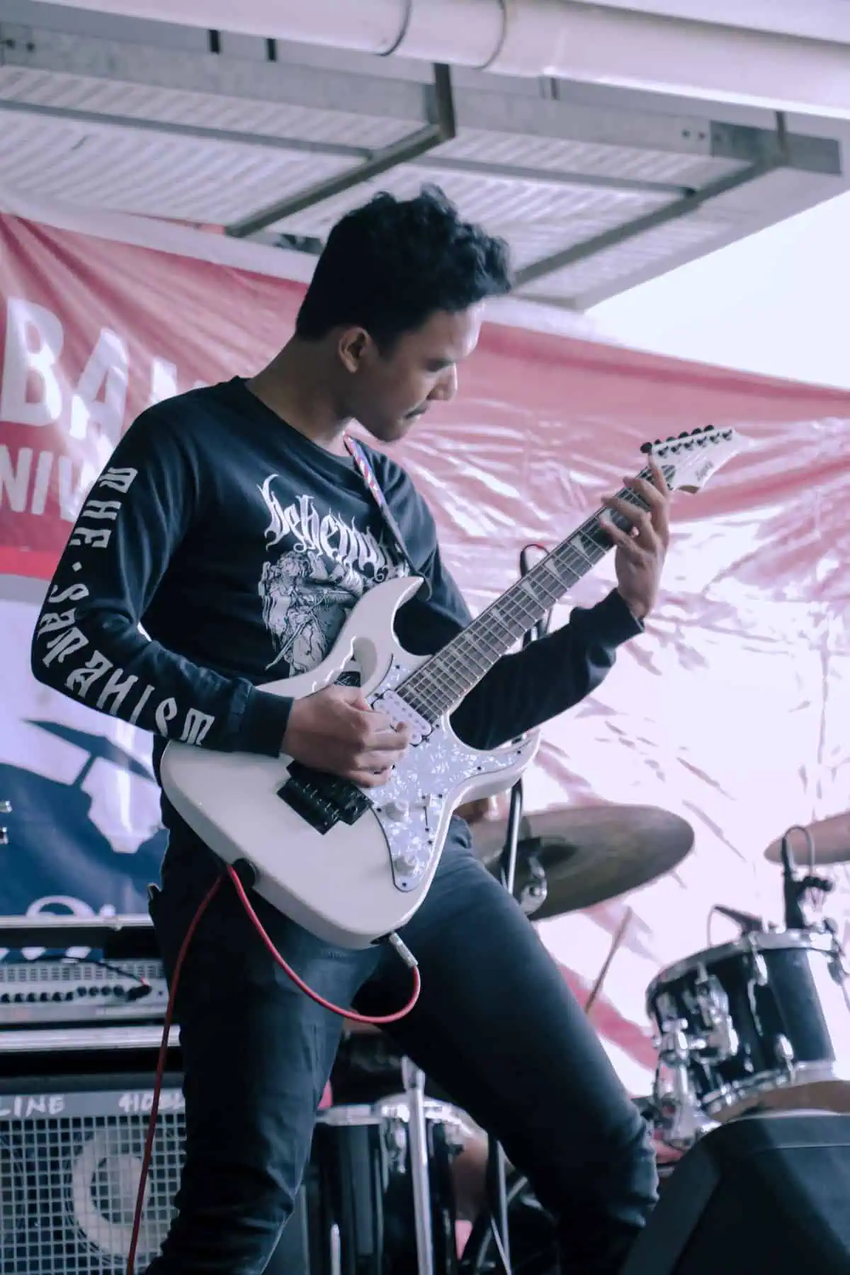 Guitarist kicking on one of the best boost pedals for a solo