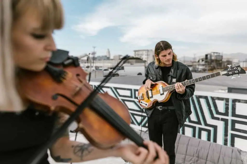 How to Co-Write a Song: Etiquette, Splits & Session Tips 1 How to co write a song: two musicians co-writing together with guitars