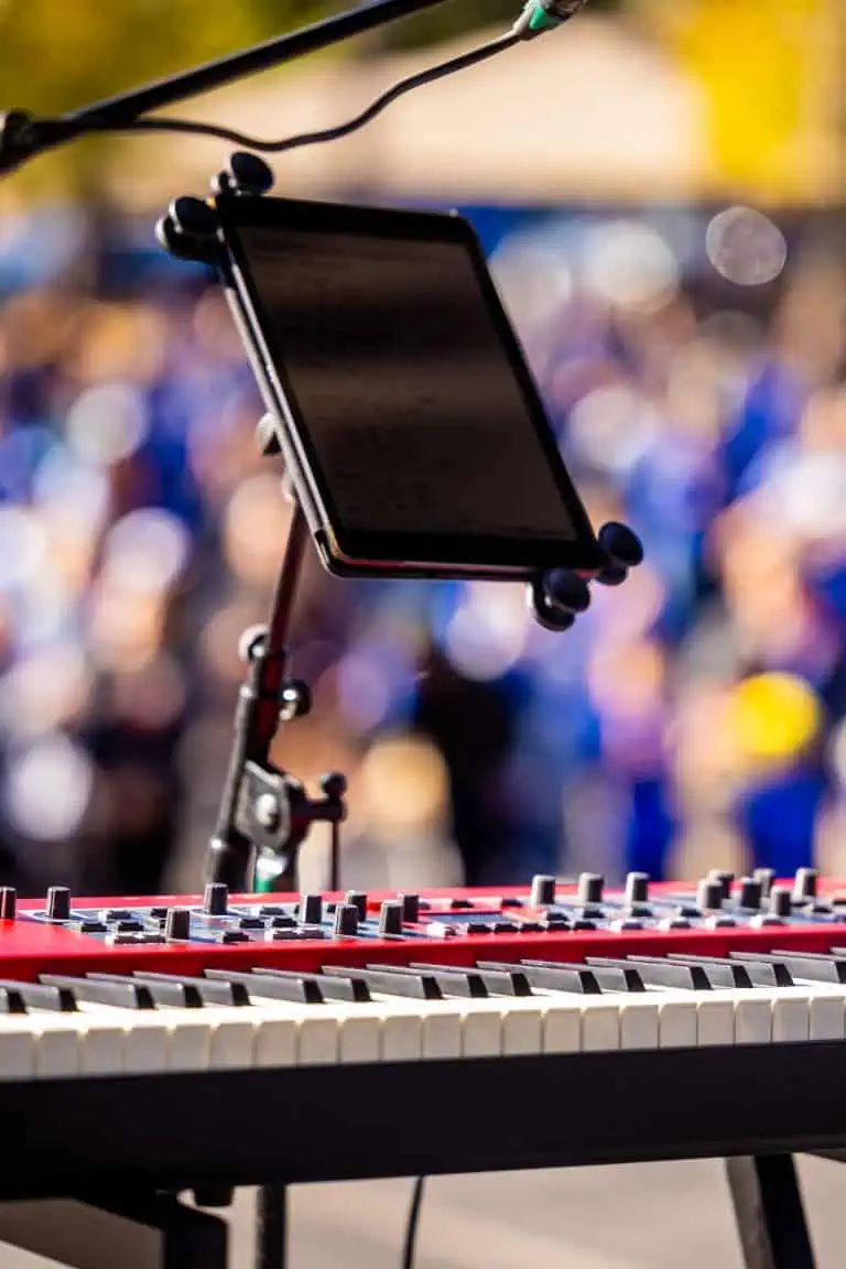 Tablet on a stand on stage showing a worship chord chart app during a service